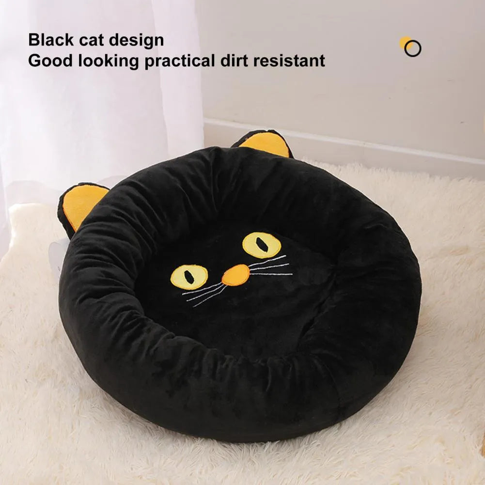 Black cat shaped velvet pet bed with raised edges for feline head and neck support