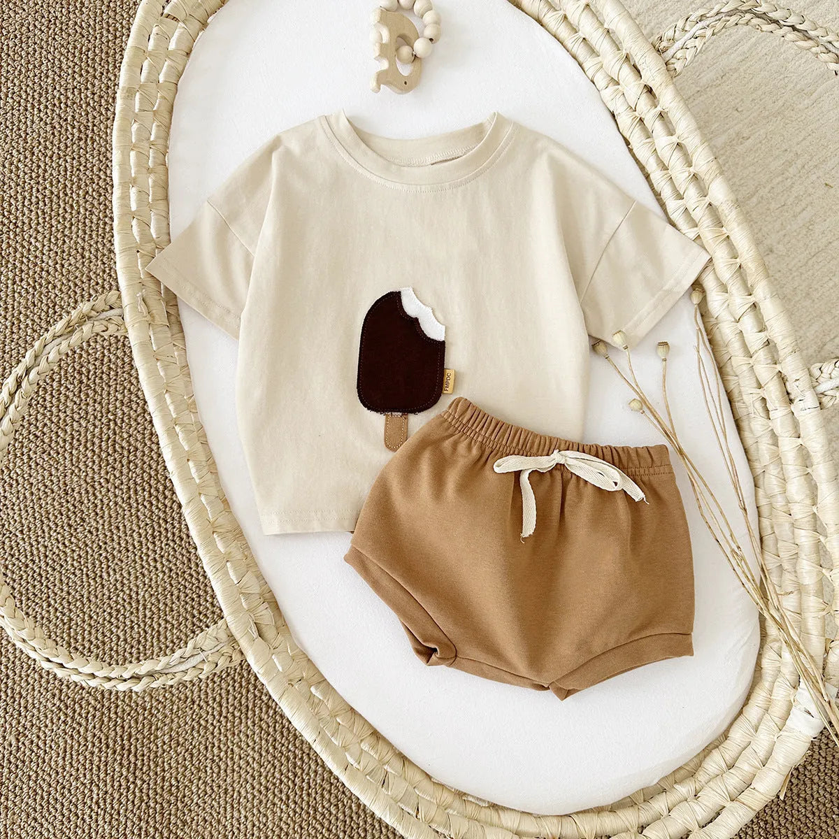 Girls' apricot coloured cotton shorts suit set with ice cream patch, short sleeves and round neck.