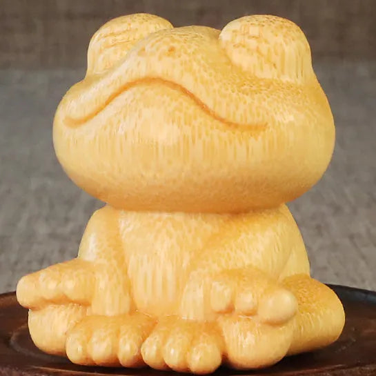 Solid bamboo smiling frog carving ornament with cartoon style measuring 5cm tall