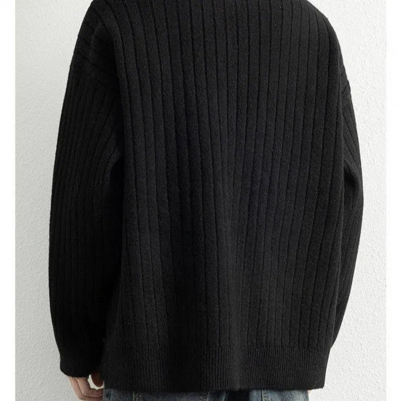 Men's grey half zip loose knit sweater with textured fabric and long sleeves