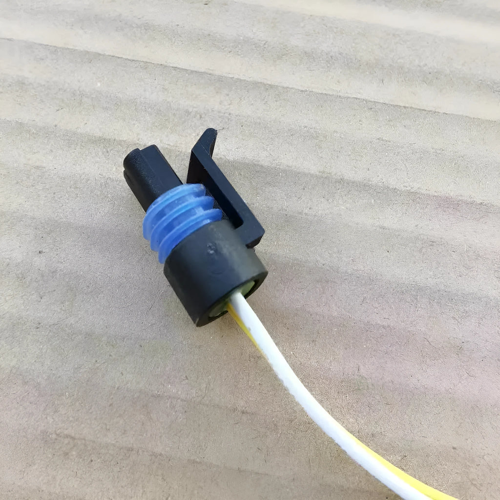 ACDelco brand water temperature sensor plug for automotive coolant system replacement.