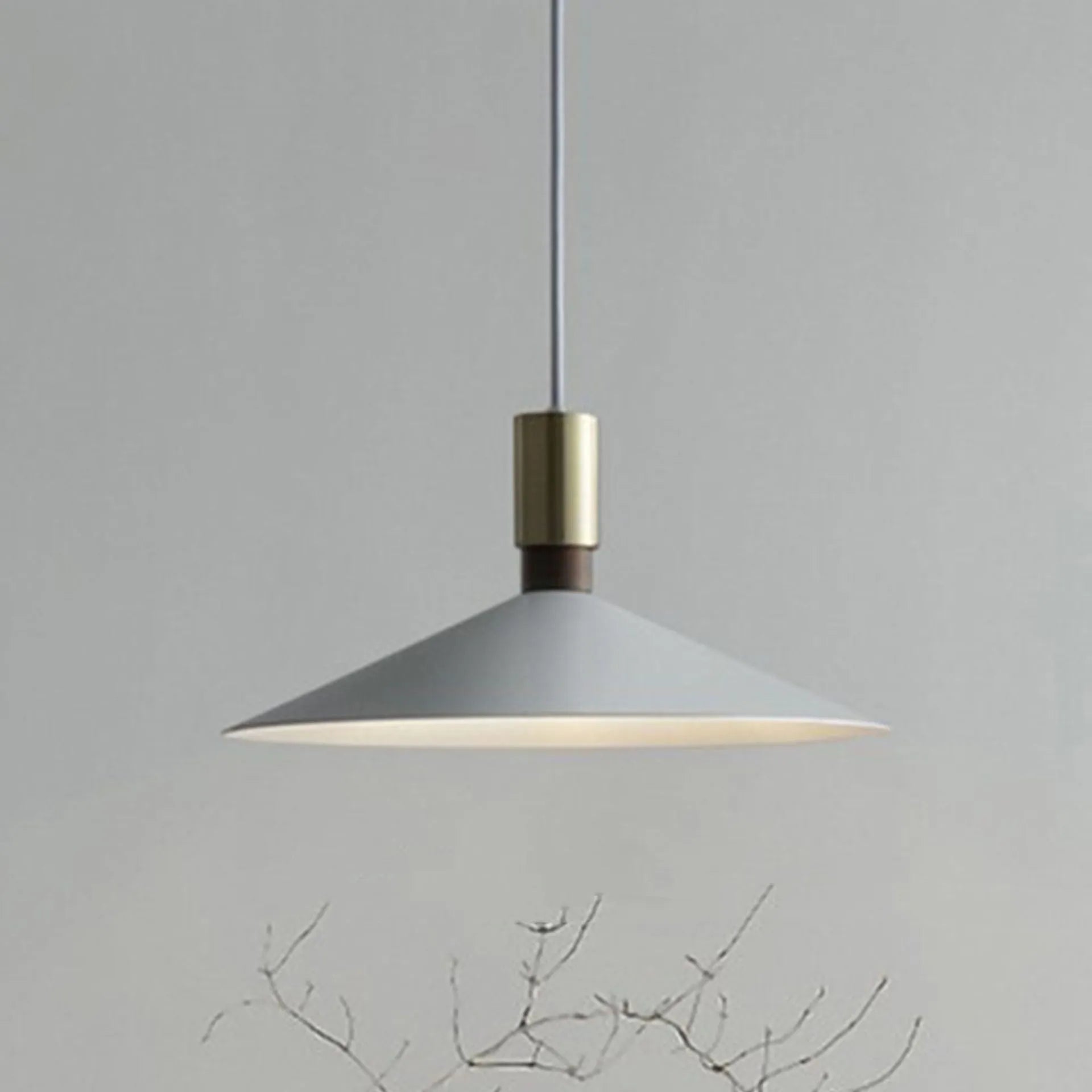 Minimalist single-headed round iron table lamp shown in black, 42cm diameter, hanging above a dining table