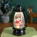 Portable crystal ball oil lamp Christmas decoration on a desktop, showing snowman and elderly figure options.