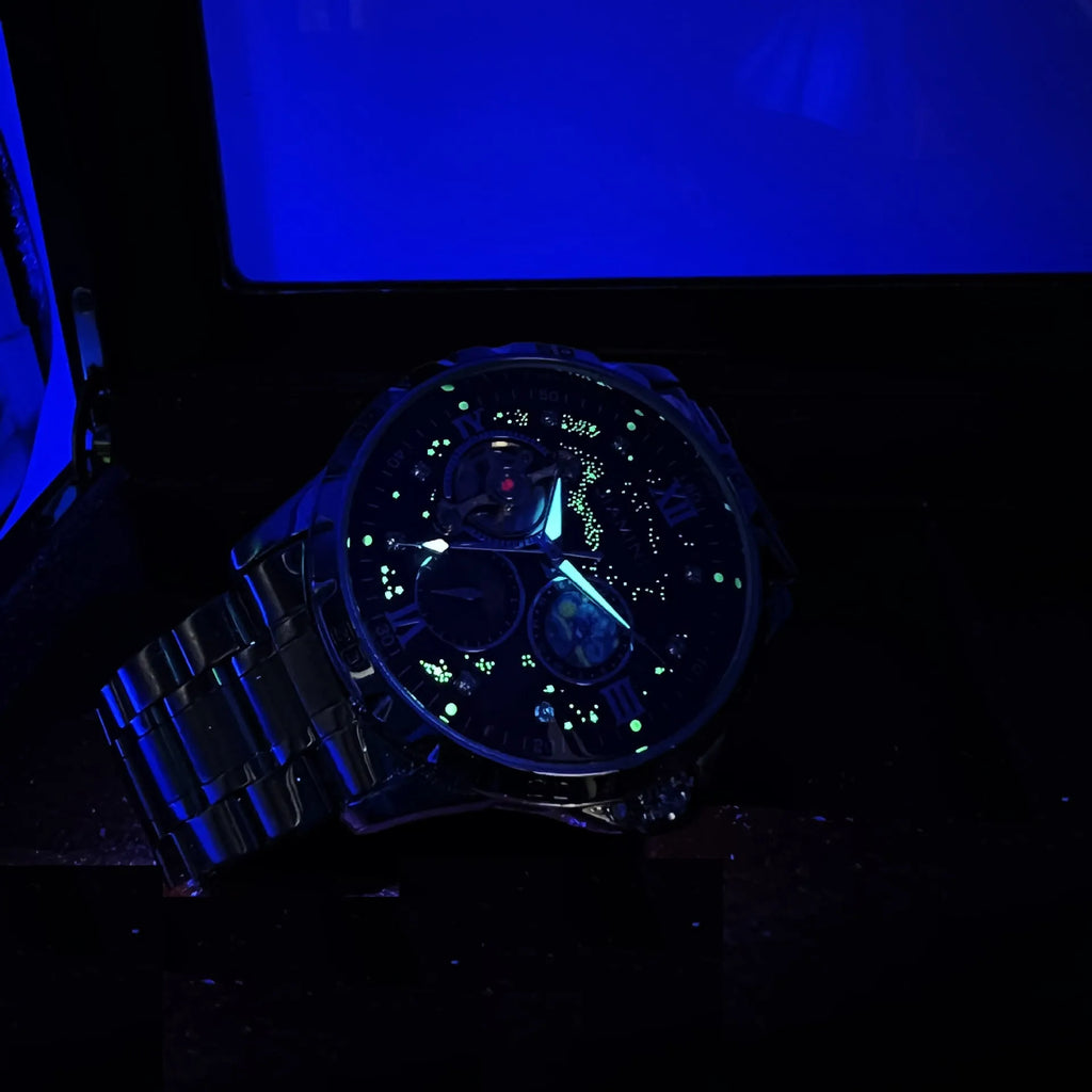 Automatic mechanical men's watch with large black dial and rose gold shell.