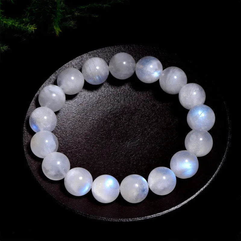 Natural blue moonlight round bead moonstone bracelet in white colour showing polished geometry-shaped beads