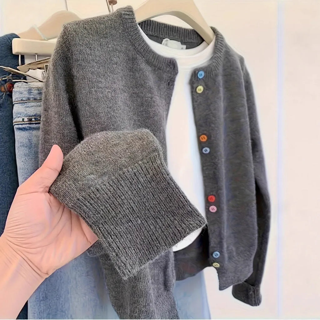 Dark grey women's polyester cardigan sweater with buttons and long sleeves on a hanger.