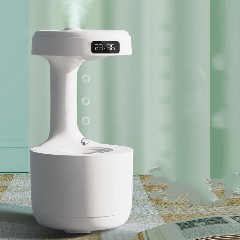 Bedroom anti-gravity humidifier with clock and backflow aroma diffuser in white plastic on desk with LED display