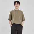 Men's loose fit drape knit casual T-shirt in solid colour on a hanger