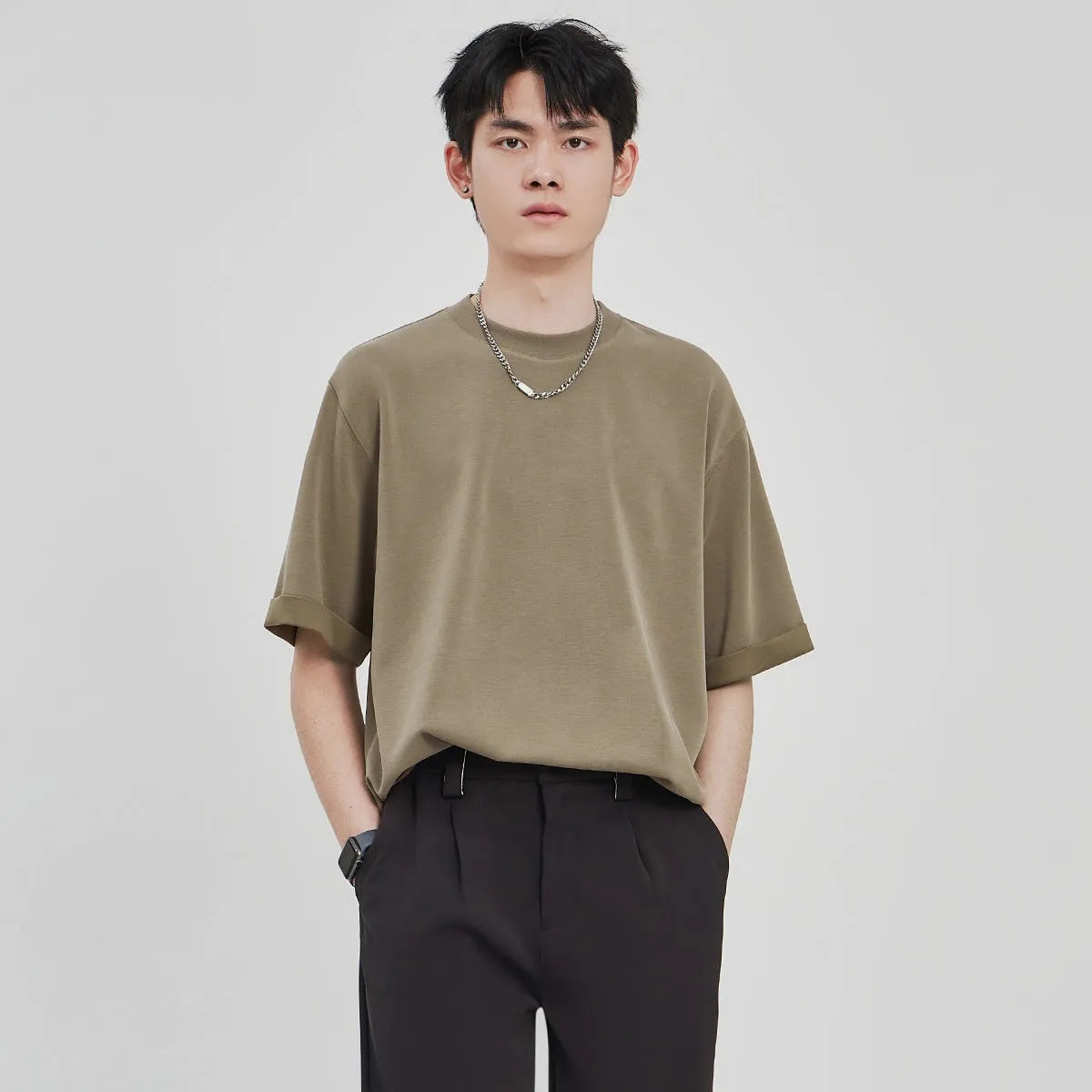 Men's loose fit drape knit casual T-shirt in solid colour on a hanger