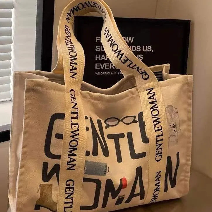 Large canvas tote bag with printed design, showing substantial capacity and casual styling