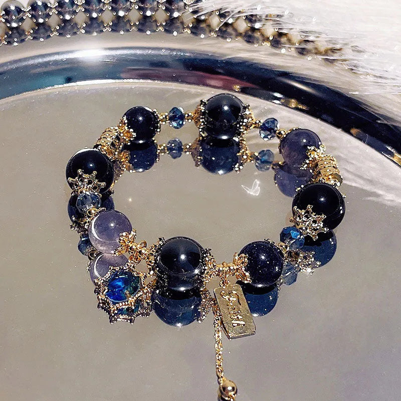 Women's sweet style galaxy colour alloy bracelet with snowflake pendant, heart, bow and cartoon character charms.