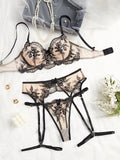 Women's embroidered see-through cutout lingerie set in polyester, shown in sapphire blue, including top, t-pants, and garters.