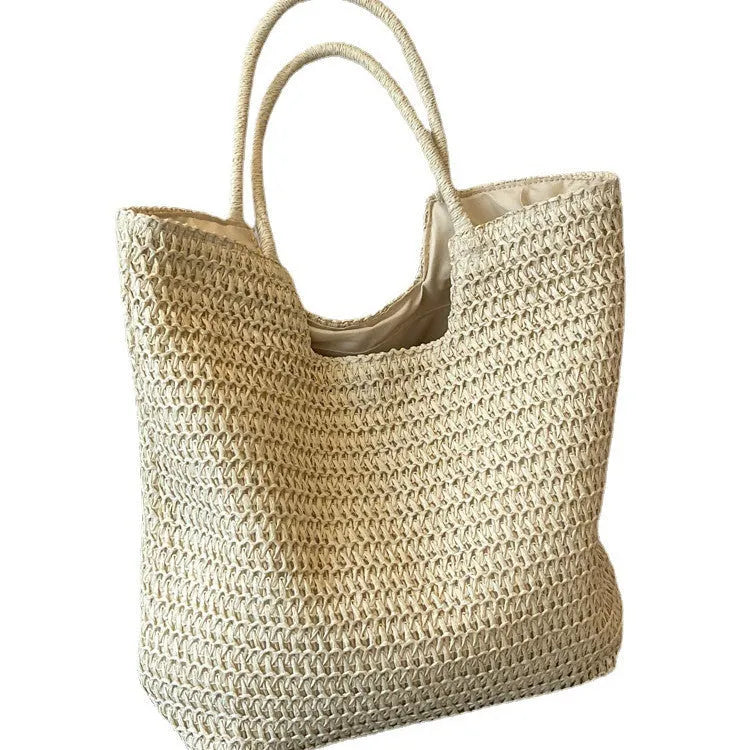 Women's large capacity straw bag in beige with canvas lining and double shoulder straps