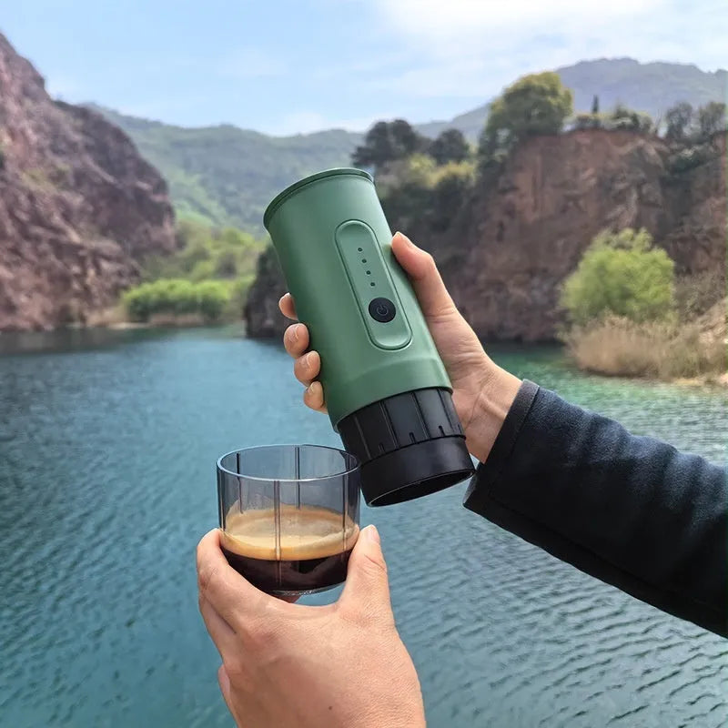 Handheld portable electric coffee machine in Jungle Green colour with car charger cable.
