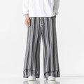 Man wearing vintage stripe loose straight leg cotton blend mopping pants in khaki colour.