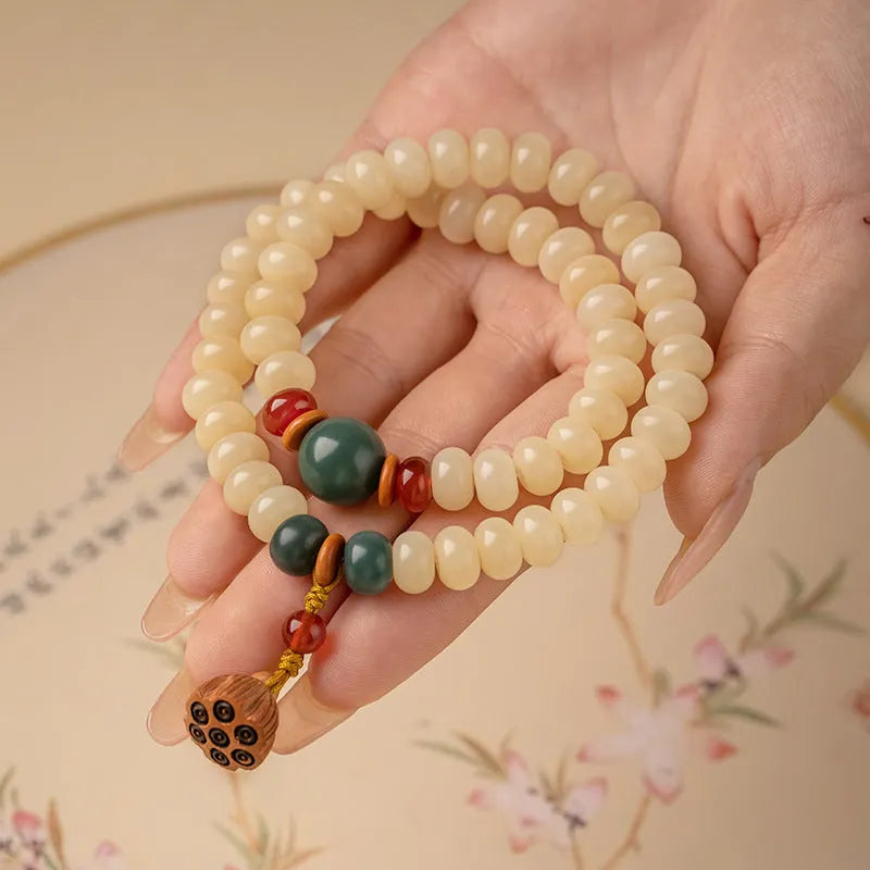 Wooden milk butter Bodhi root bracelet with 6x9mm flat round beads on wrist