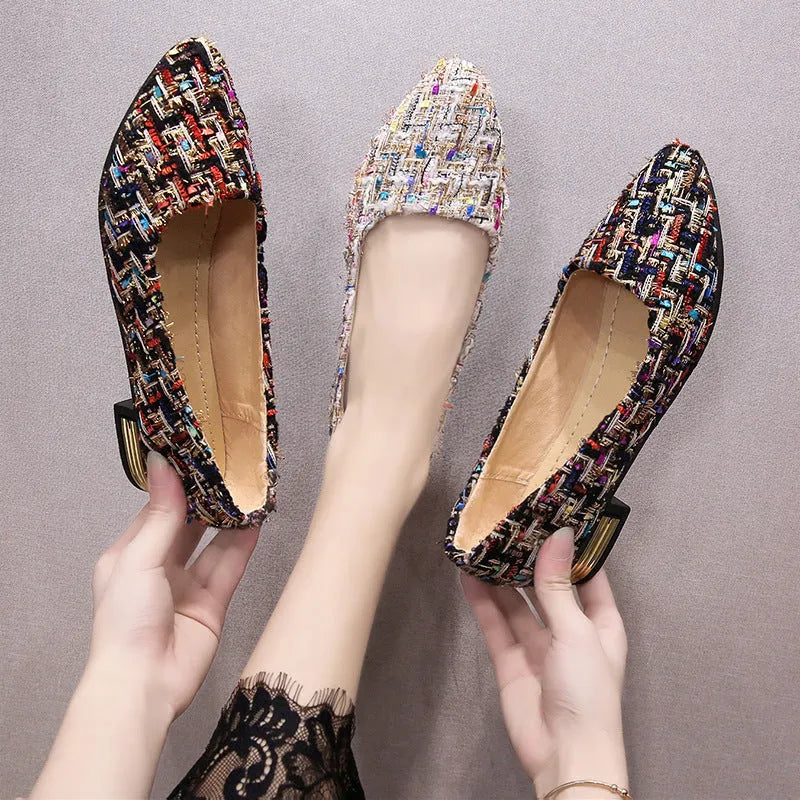 Women's black and white canvas flats with flower pattern, pointed toe, and low-cut design