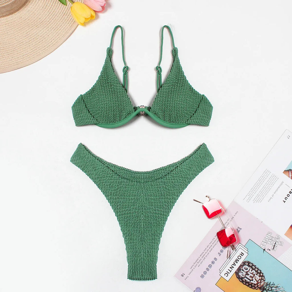 Green women's bikini with ruffle detail on quick-dry polyester fabric.