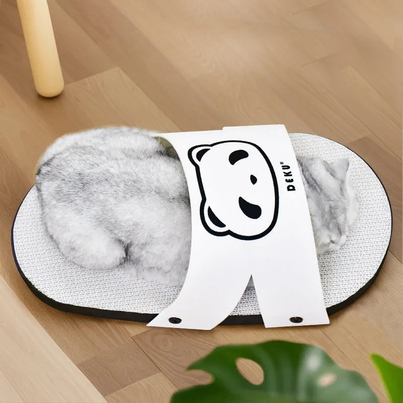 White corrugated paper cat scratch board in a slipper style design on a floor.