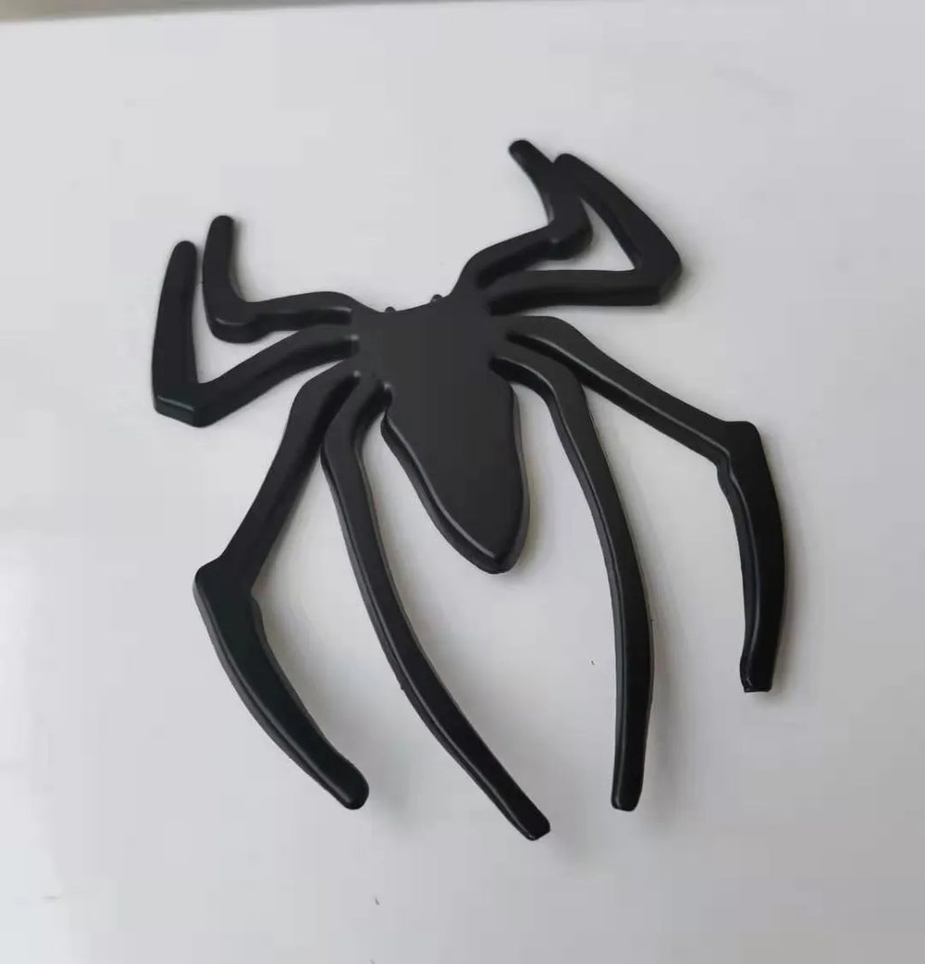 Three-dimensional zinc alloy spider emblem sticker in gold, measuring 7cm by 5cm.