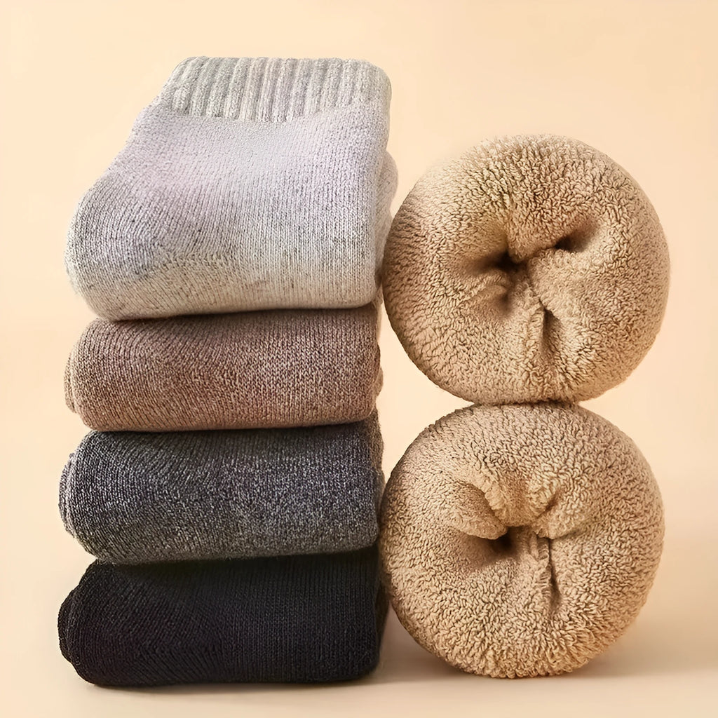 Pair of thick wool socks with a merino wool midsole in a cold-resistant dark grey colour.