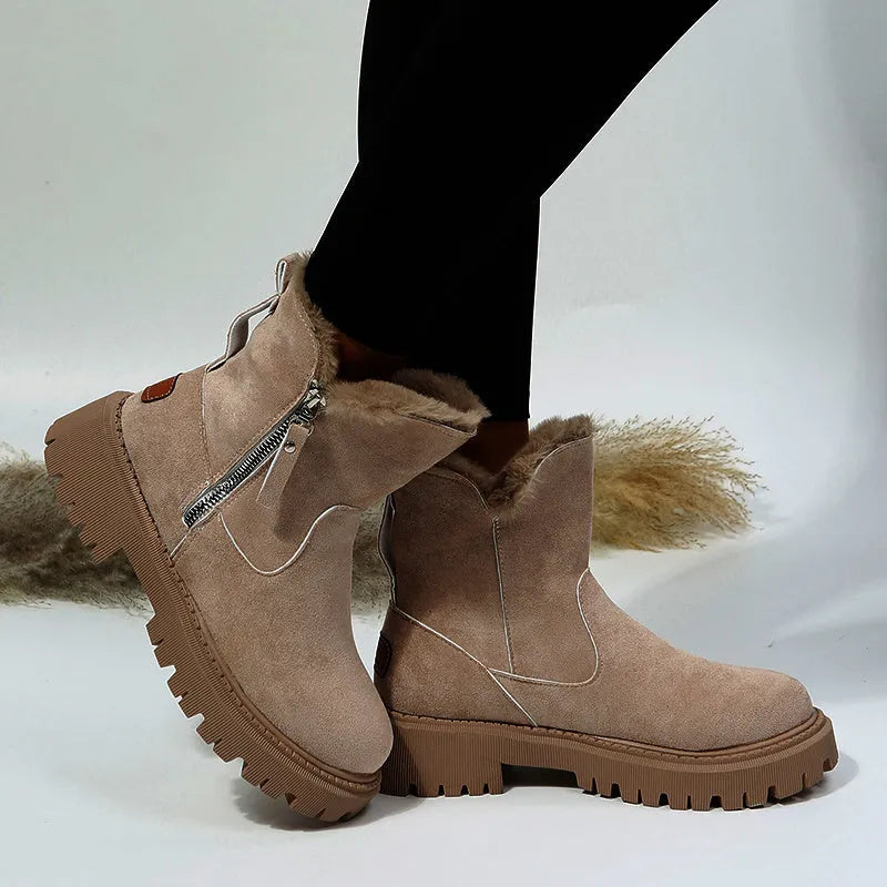 Women's black high-top snow boots with a side zipper and round toe on a non-slip rubber sole.