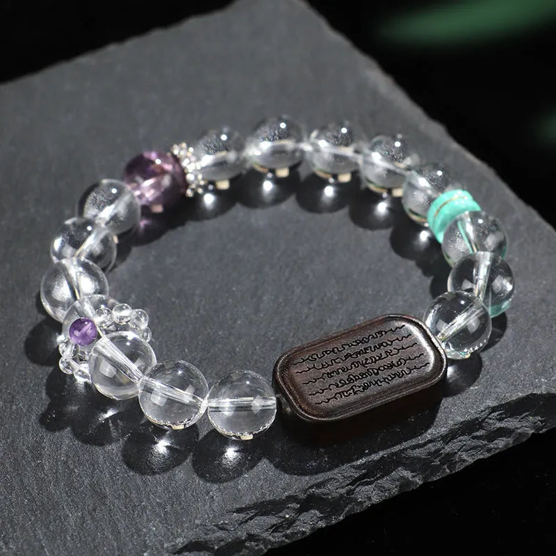 Natural white crystal ebony five warp bracelet on wrist showing handmade ethnic design