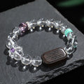 Natural white crystal ebony five warp bracelet on wrist showing handmade ethnic design
