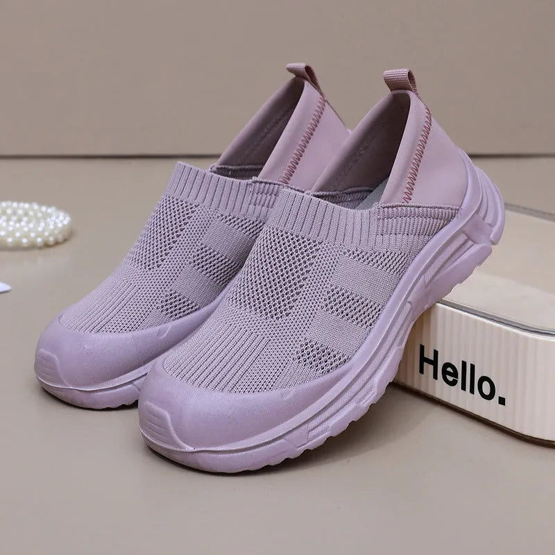 Women's black slip-on shoes with cloth upper and PVC sole in round-toe design