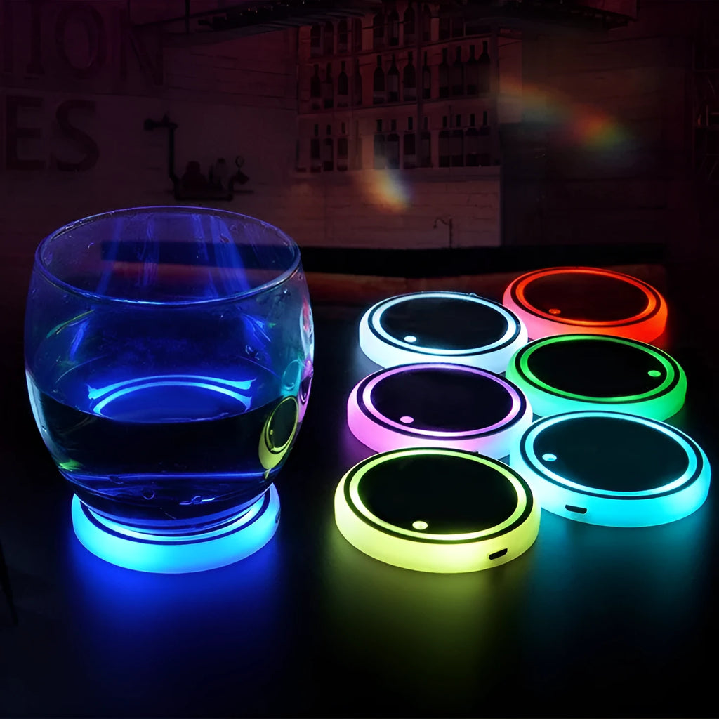 Colourful LED light-up coaster for car cup holder with USB cable, showing multiple light colours.