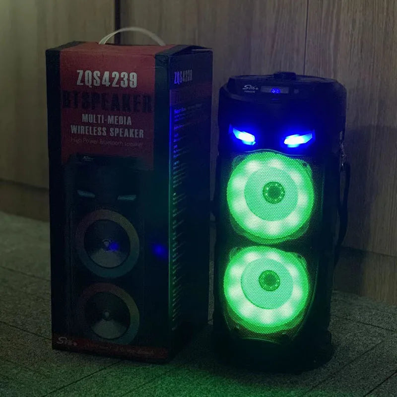 Black portable Bluetooth speaker with colourful dual horns, showing front panel with controls.