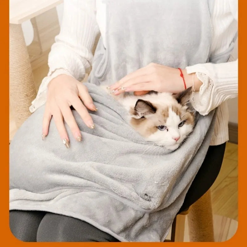 Beige plush pet carrier apron with adjustable neck strap and pet head opening