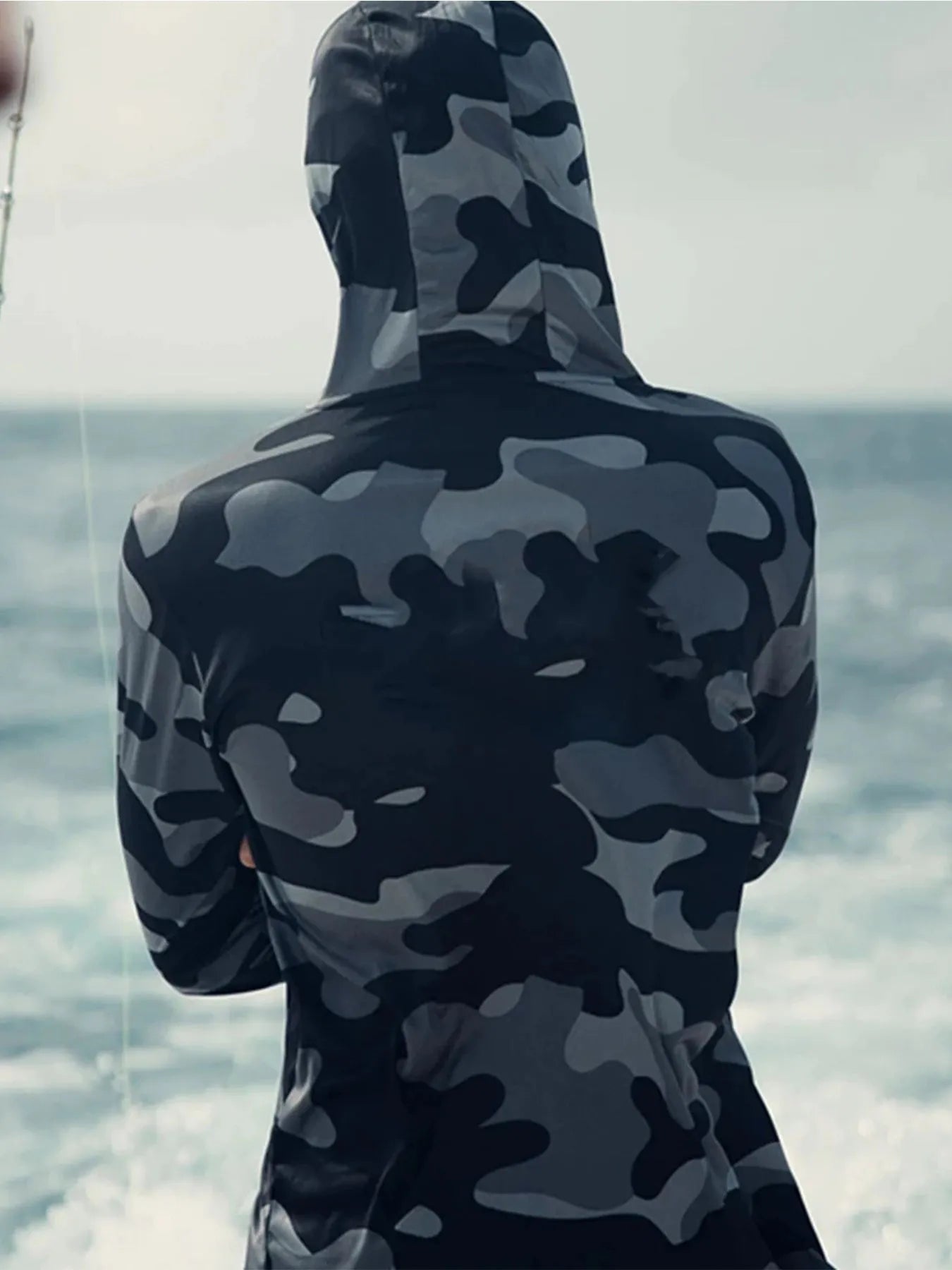 Huk Pursuit long sleeve fishing shirt with crew neck and mesh side panels for breathability.