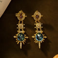 Gold geometric retro stud earrings with diamond treatment and round elements