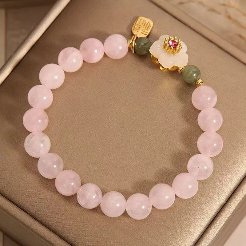 Crystal bracelet with Hetian jade beads, peach blossom charms, and camellia elements in pastoral design