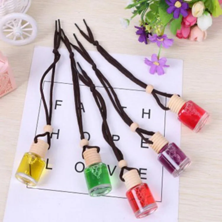 Glass bottle car air freshener hanging ornament with 55g fragrance options including lavender, lemon, apple, strawberry, ocean, and floral scents