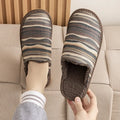 Household cotton slippers with winter linen surface and PVC sole in various floral colour patterns