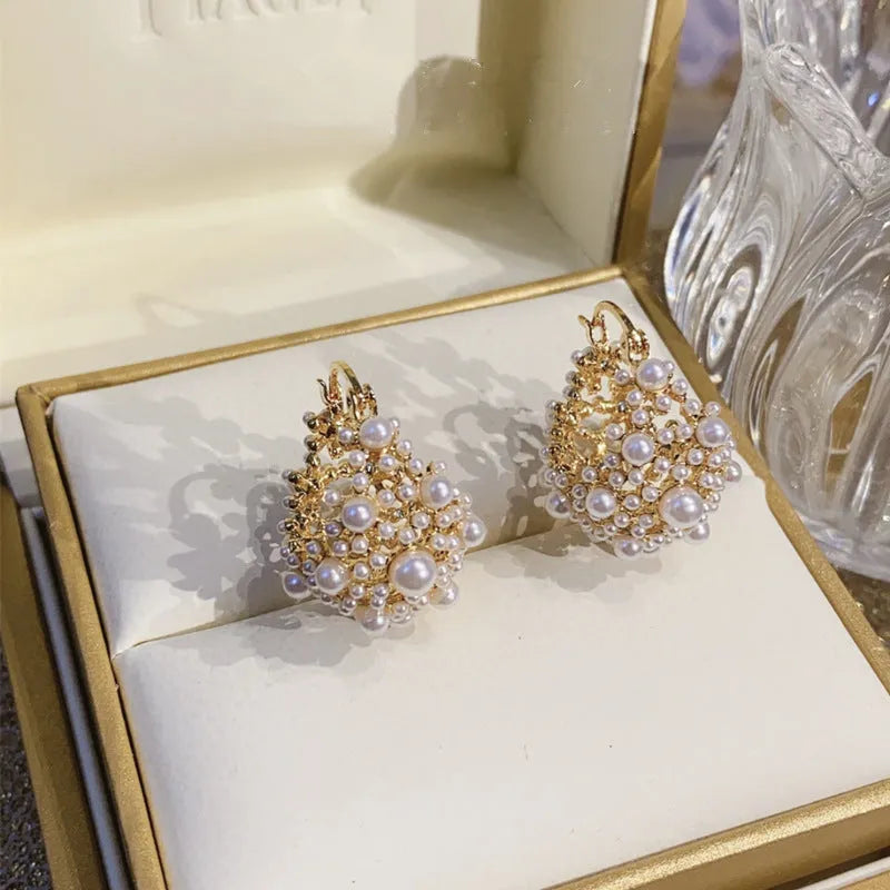 Gold-colour copper flower basket earrings with small beads and pearl inlay decoration