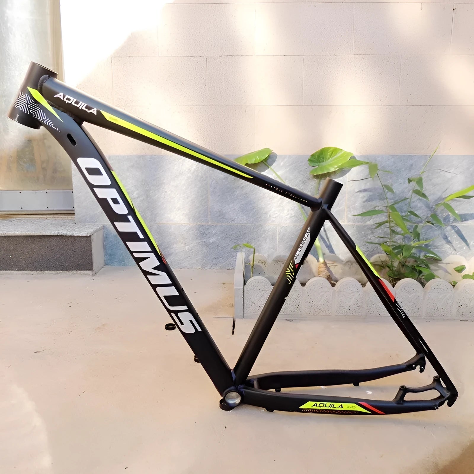 Black green 29-inch aluminium mountain bike frame showing disc brake mounts and inner line routing