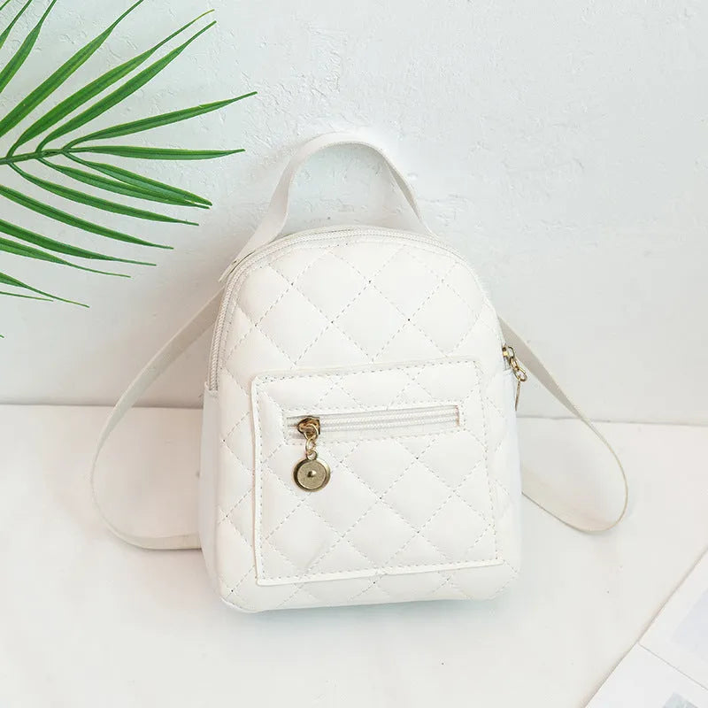 Girls' hard square PU backpack with embroidery in pink, showing front sandwich pocket and carry handle.