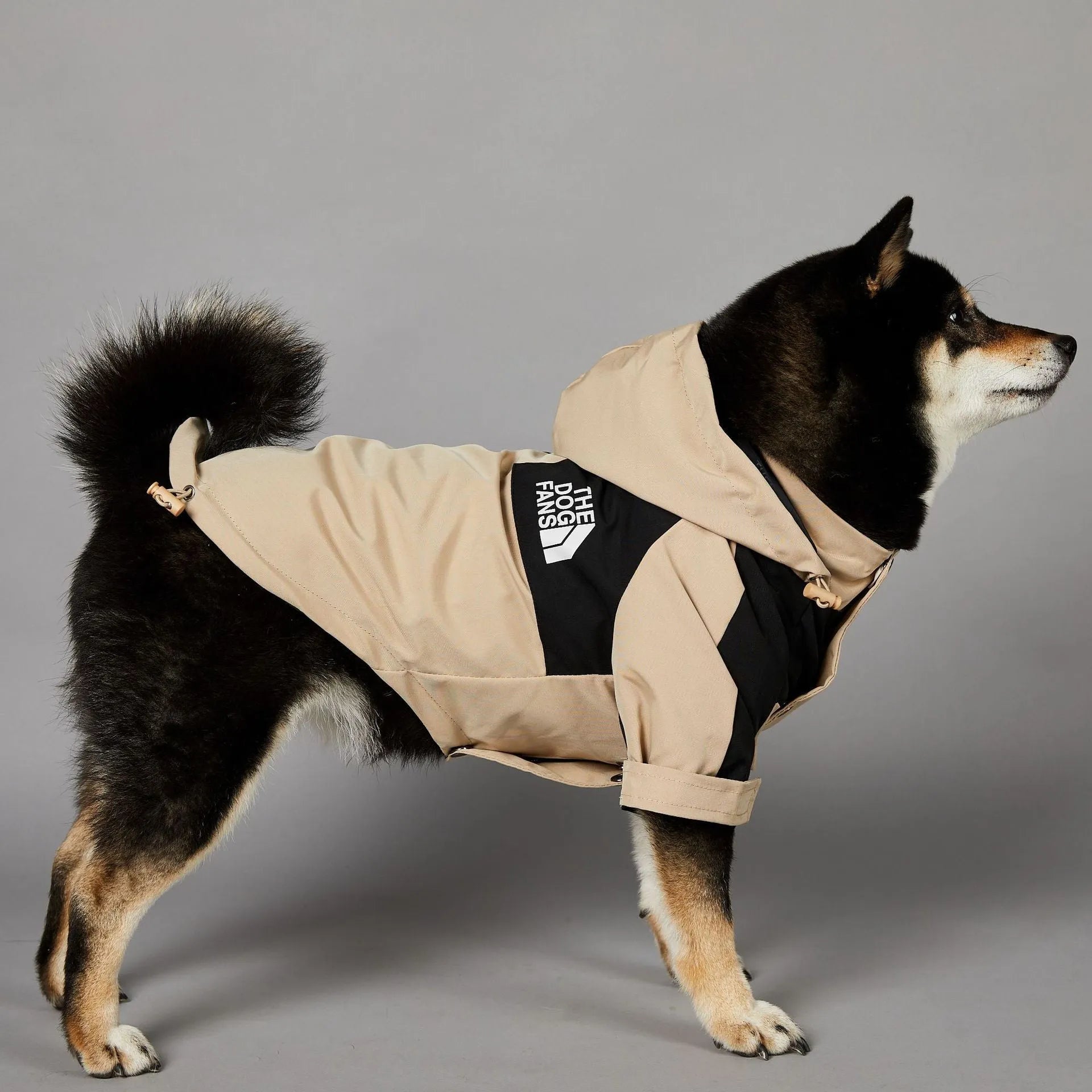 Khaki coloured polyester shell jacket for dogs showing lightweight construction