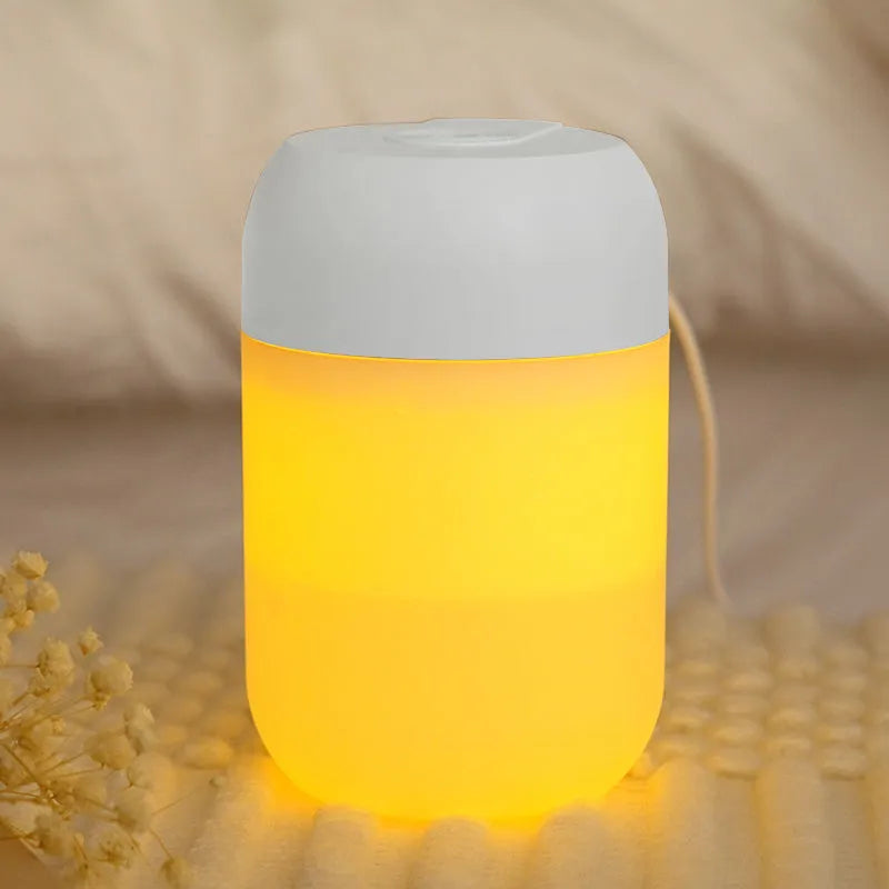 White cylindrical USB mini humidifier with charging cable