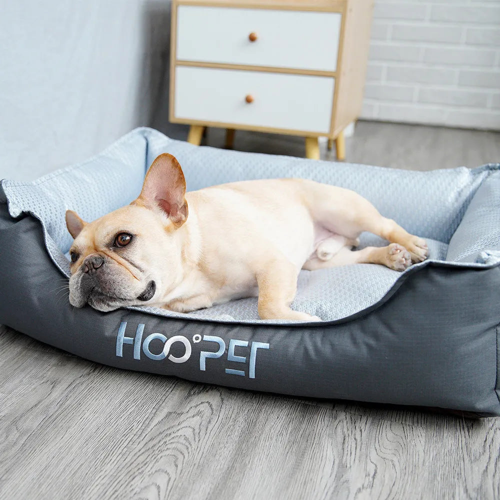 Soft grey dog bed with removable cover in small, medium, and large sizes.