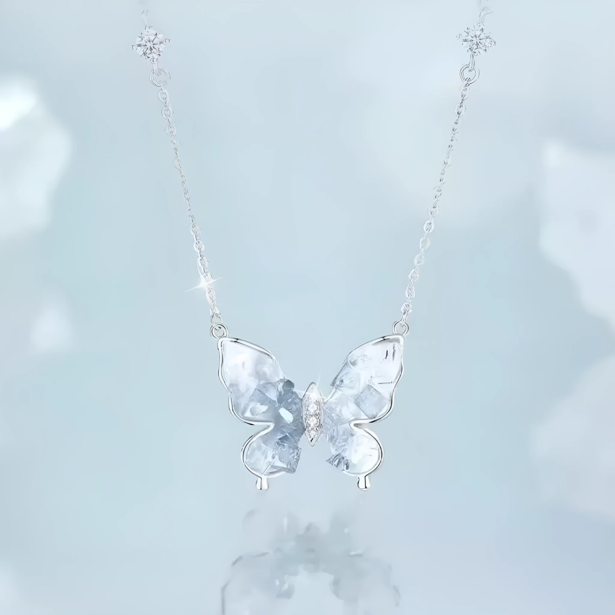 Close-up of a silver Bingyu Butterfly necklace with an ice rain pendant on an adjustable O-ring chain.