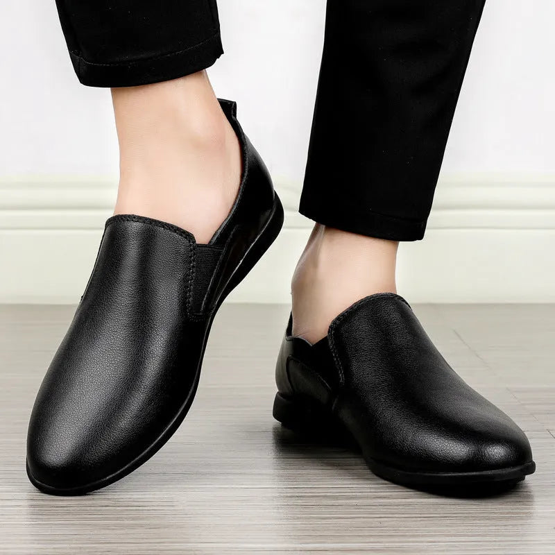 Men's black leather round toe business casual shoes on a white background
