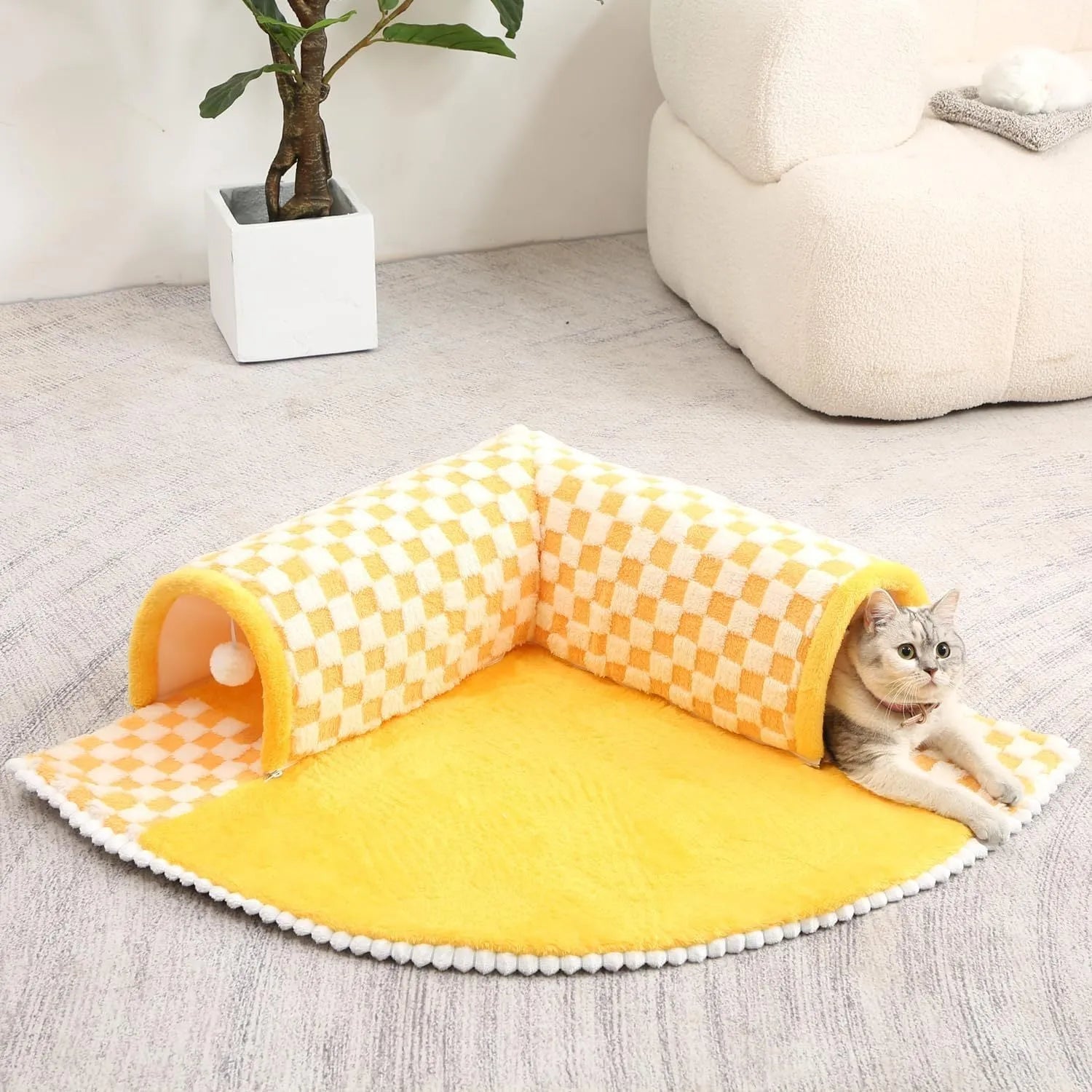 Fan shaped plush pet bed with integrated tunnel in plaid design, shown in coffee colour.