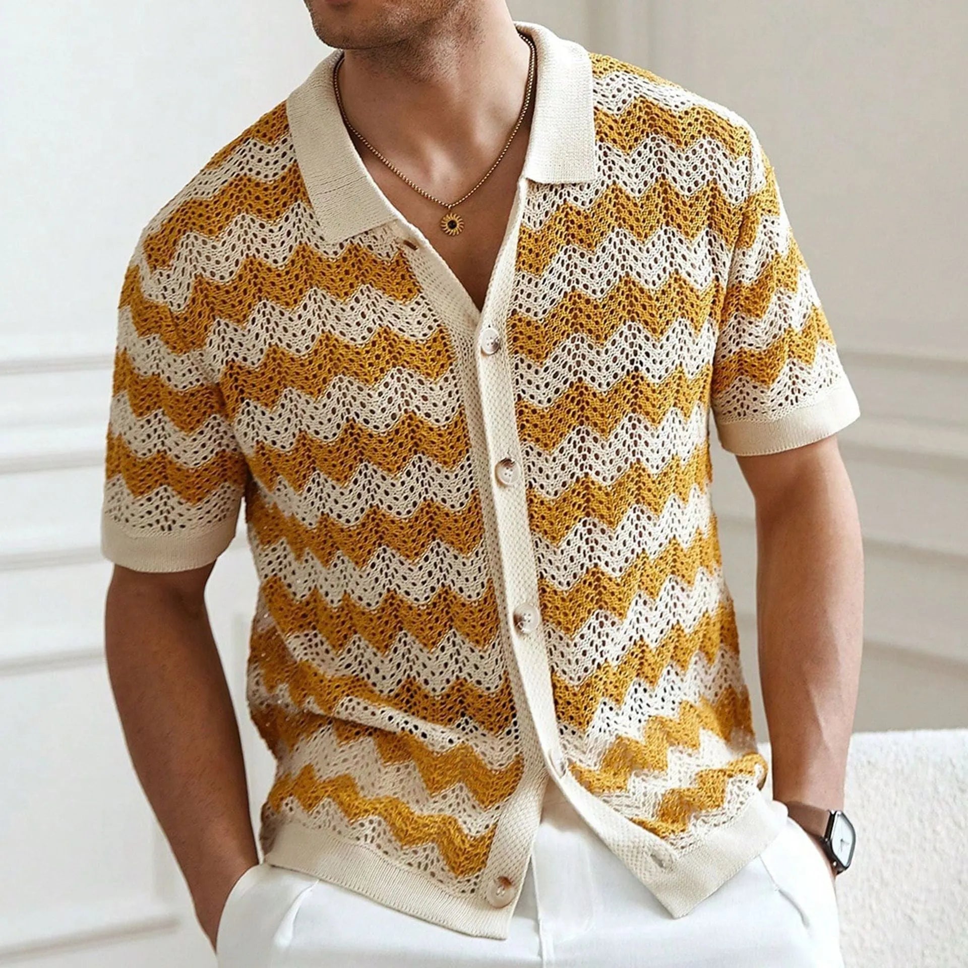 Blue American-style corrugated short-sleeved sweater with jacquard texture on a hanger.