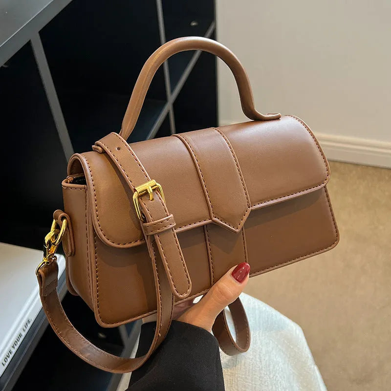 Women's PU leather messenger bag in horizontal square shape with sandwich pocket and file organisation