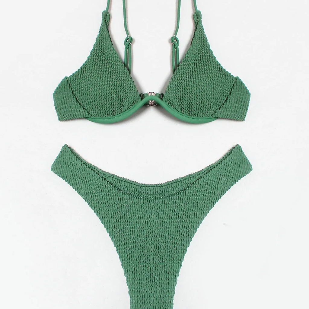 Green women's bikini with ruffle detail on quick-dry polyester fabric.