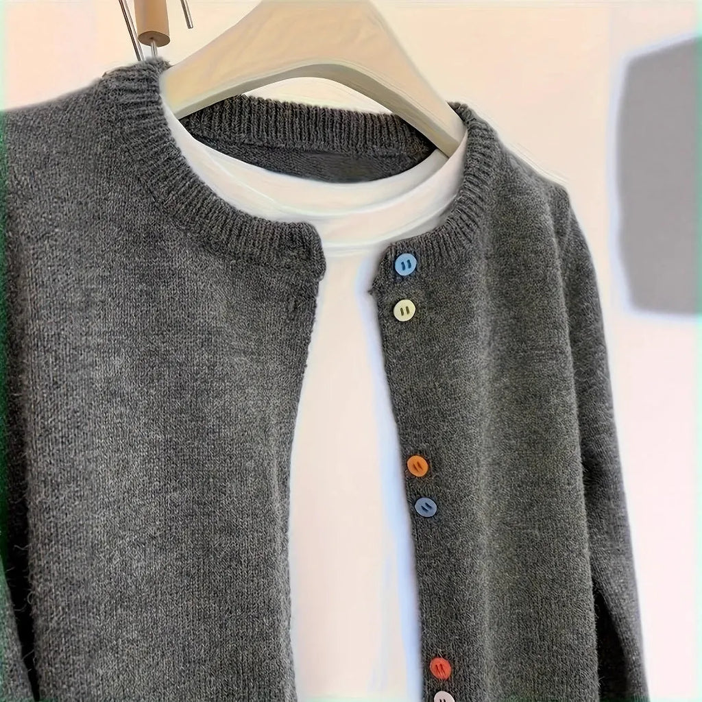 Dark grey women's polyester cardigan sweater with buttons and long sleeves on a hanger.